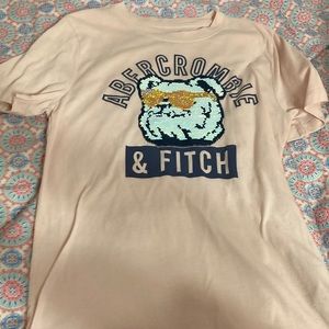 A baby pink Abercrombie shirt with sequins.